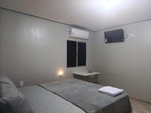 Voodi või voodid majutusasutuse Pernoite Suíte Casal - CENTRO - LUZ DO NORTE toas