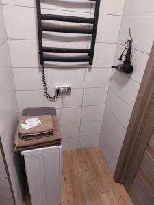 a small bathroom with a table and a phone at Loft city center in Poltava +12 photos