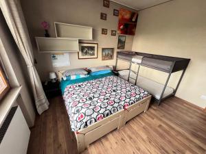 a bedroom with a bed and a bunk bed at Villa Gianfranca - sentiti come a casa in Corno di Rosazzo