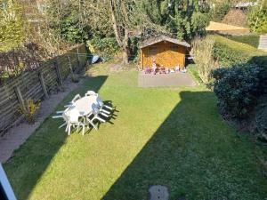 a garden with a statue of a sheep on the grass at Cozy&Spacious apartment with garden in Antwerp