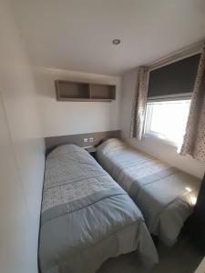 Ένα ή περισσότερα κρεβάτια σε δωμάτιο στο MOBIL HOME LA Mec