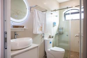 a bathroom with a toilet and a sink and a shower at An Nhiên Hotel & Villa Da Lat in Da Lat +29 photos