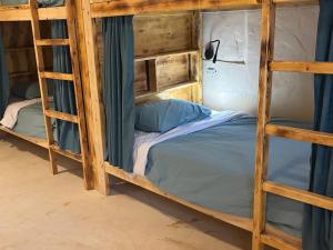 Postel nebo postele na pokoji v ubytování Siwa Oracle Hostel