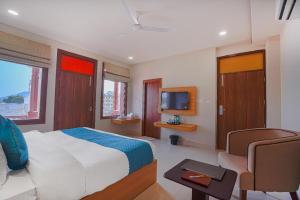 Postel nebo postele na pokoji v ubytování The Aanandam By Agravansh