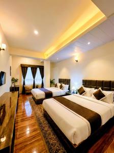 Ένα ή περισσότερα κρεβάτια σε δωμάτιο στο Hidden Mazong Crest - A Premium Top Rated Property in Gangtok