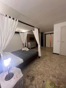 Ένα ή περισσότερα κρεβάτια σε δωμάτιο στο Al Castello