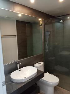 a bathroom with a sink and a toilet and a shower at Stylish Urban Escape 1Bed Apt T2-822 in Ban Klang