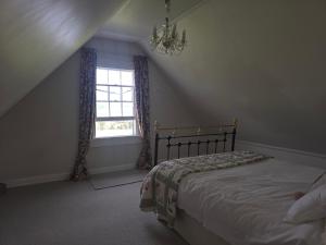 Ένα ή περισσότερα κρεβάτια σε δωμάτιο στο lindum Grange