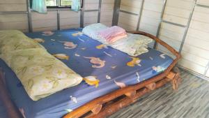 Postel nebo postele na pokoji v ubytování Billy the Homestay + 8 fotografií