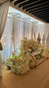 a room filled with lots of plants and flowers at Leisure29 Suites in Kuantan