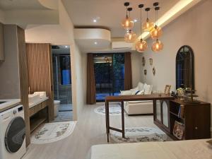 a living room with a table and a couch at 琥珀皇后館 Amber Queen Chambers in Taipei