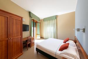 Postel nebo postele na pokoji v ubytování Astura Palace Hotel