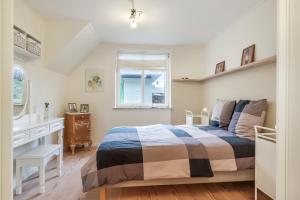 Ένα ή περισσότερα κρεβάτια σε δωμάτιο στο Strandhuset B&B