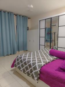 Ένα ή περισσότερα κρεβάτια σε δωμάτιο στο Homestay Beruntung Adenium