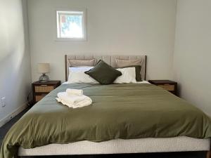 Ένα ή περισσότερα κρεβάτια σε δωμάτιο στο The Nook And Cranny Greytown