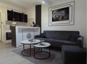 a living room with a couch and a table at Apartmani Crystal in Višegrad