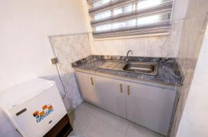 Kuchyň nebo kuchyňský kout v ubytování Blueline Apartments & Suites + 23 fotografií