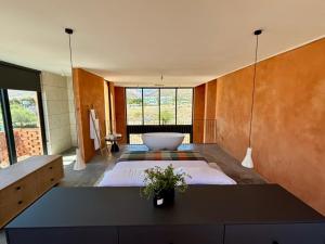 a large room with a large bed and a tub at Prince Albert Tall House in Prince Albert +19 photos