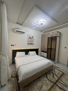 Ένα ή περισσότερα κρεβάτια σε δωμάτιο στο Tranquil Preston 2bed lekki