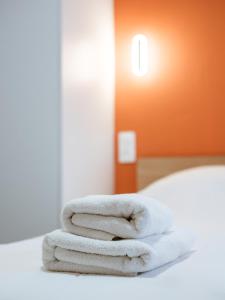 Ένα ή περισσότερα κρεβάτια σε δωμάτιο στο Studio rez de chaussée avec terrasse centre thermal et touristique - Casa Amnéville