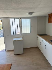 Kuchyň nebo kuchyňský kout v ubytování Estudio Cartama estación