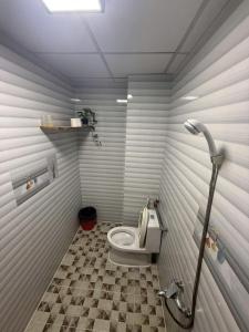 a bathroom with a toilet in a room at ấm iu Hotel in Ho Chi Minh City