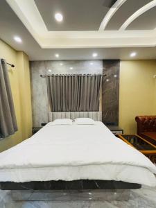 Ένα ή περισσότερα κρεβάτια σε δωμάτιο στο Annapurnq Banquet And Inn