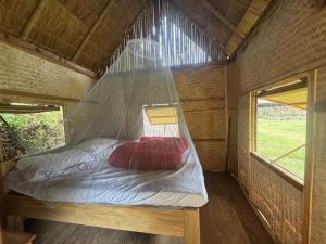 Postel nebo postele na pokoji v ubytování Petros Bungalows