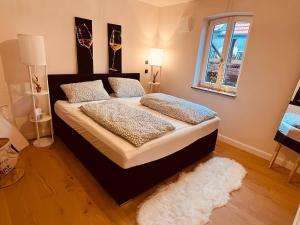 Ένα ή περισσότερα κρεβάτια σε δωμάτιο στο VagabundNEST Altstadt Freinsheim