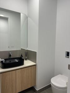 a bathroom with a sink and a toilet at McCrae Retreat Brand New Home in McCrae +21 photos