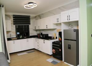 Kuchyň nebo kuchyňský kout v ubytování Mercella Homes