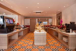 a hair salon with a buffet line in a room at The Lantern Resorts Patong - SHA Extra Plus in Patong Beach