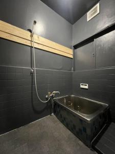 a bathroom with a bath tub and a shower at Sagamihara - House - Vacation STAY 15450 in Toya +15 photos