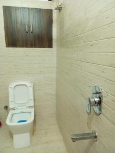 a bathroom with a toilet and a shower at EnDai House - Kalyanpuri, Uppal in Hyderabad +23 photos