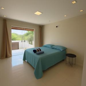 Ένα ή περισσότερα κρεβάτια σε δωμάτιο στο Village GRAND LUX exclusivo com piscina privativa