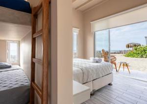 Ένα ή περισσότερα κρεβάτια σε δωμάτιο στο Ribera Del Norte Bungalows +124 φωτογραφίες