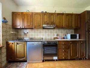 Kuchyň nebo kuchyňský kout v ubytování Appartamenti da Miranda