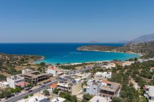 an aerial view of a town and the ocean at Istron Blue in Istron