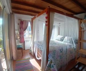 Ένα ή περισσότερα κρεβάτια σε δωμάτιο στο Casa da Casimira