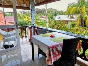 a table and chairs on the balcony of a house at Relax in Paradise in Victoria