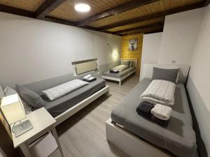 a bedroom with two beds in a room at Blue Sky Apartments in Göschenen