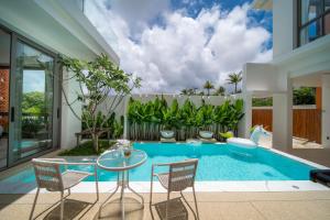 Bazén v ubytování Coconus Pool Villa 阿丽莎 泳池别墅 nebo v jeho okolí