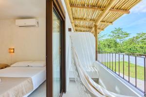 En eller flere senge i et værelse på Villa da Barra Ubatuba + 53 billeder