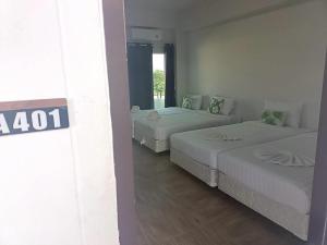 Ένα ή περισσότερα κρεβάτια σε δωμάτιο στο Comfy Hotels Suvarnabhumi Airport