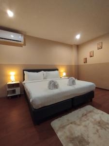 Ένα ή περισσότερα κρεβάτια σε δωμάτιο στο SSS Room Patong