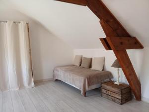 Postel nebo postele na pokoji v ubytování Gîte du Palais