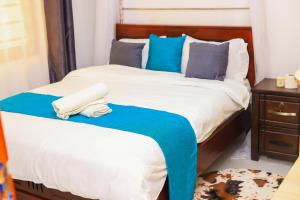 Ένα ή περισσότερα κρεβάτια σε δωμάτιο στο Mina Homes