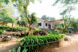 a house with a garden in front of it at Brescia villa - Your Private Escape in matara in Gandara West