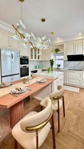 a kitchen with a large wooden table and chairs at York House in Exmouth