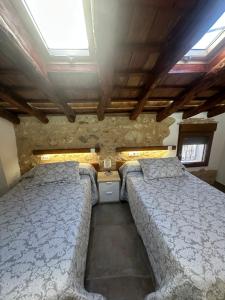 a bedroom with two beds in a room at Casa Inés in Penáguila